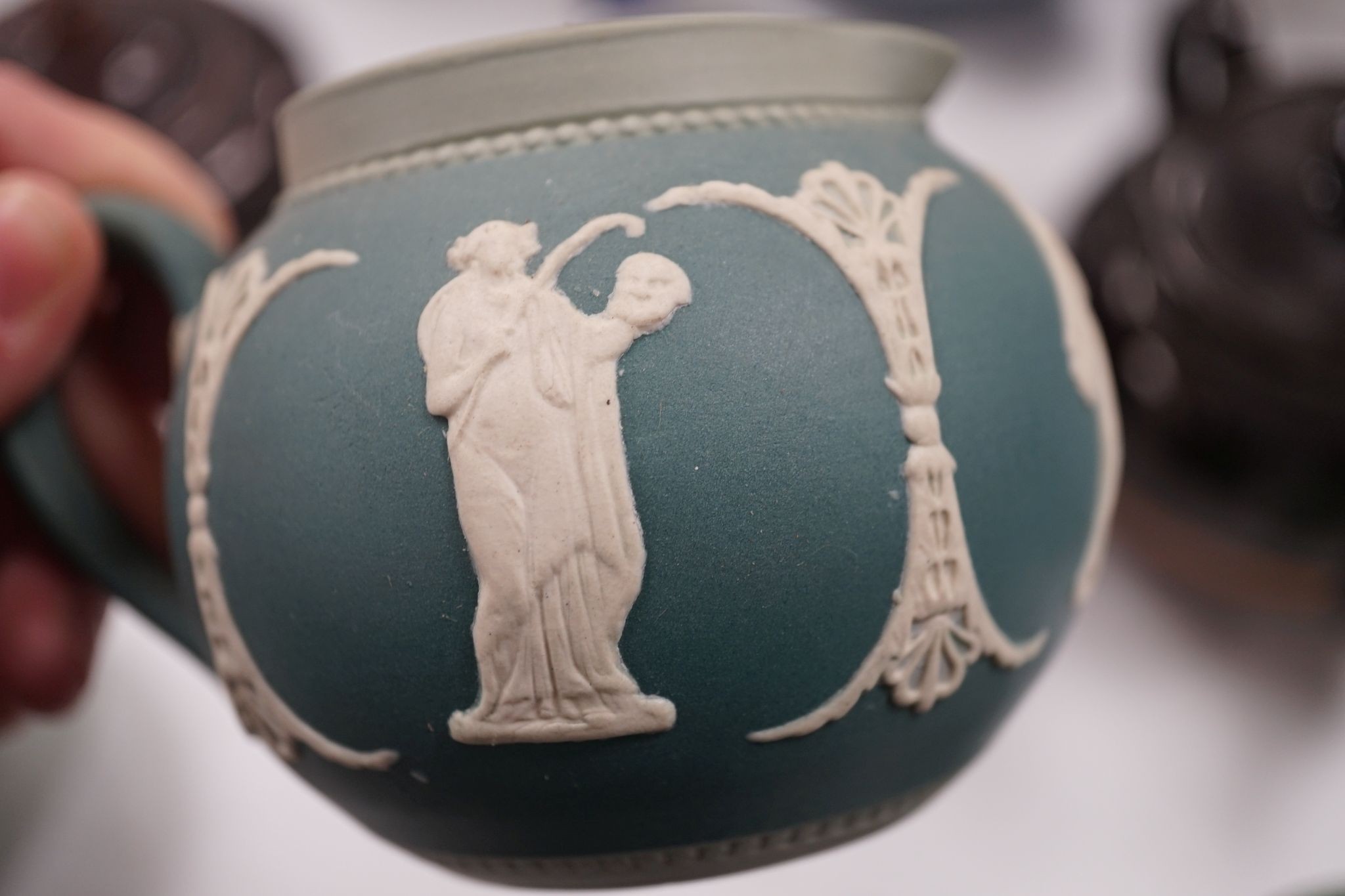 A collection of Dudson stoneware, including jugs, teapots, cream jugs etc, many decorated in low relief